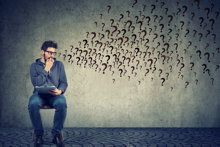Anxious Man Sitting With Resume Anticipating Interview, Having P