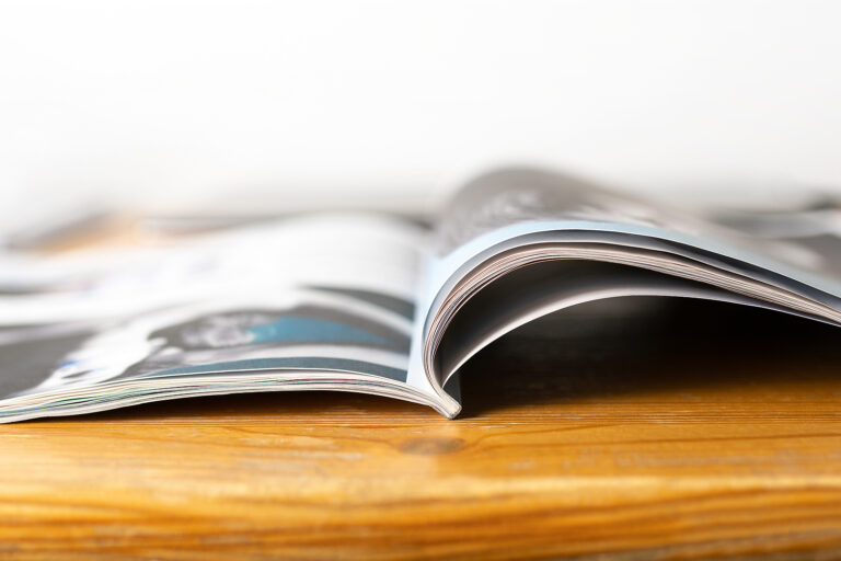 Magazine On Wooden Table. Beauty Or Fashion Tips And Trends. Ope